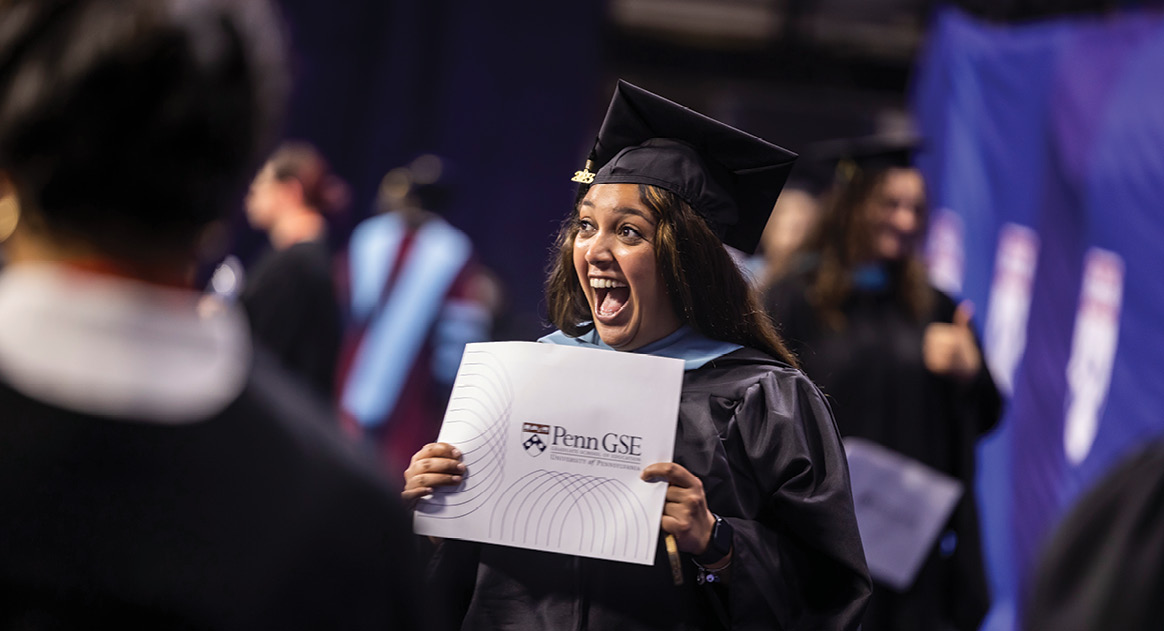 woman excited to be receiving her degree