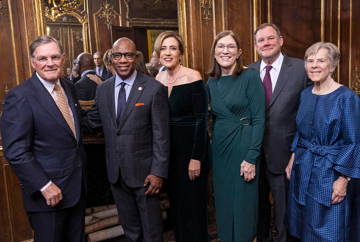 Harold “Terry” McGraw III, David Wilson, Debra Duardo, Barbara Oakley, and Robert and Suzanne McGraw standing together and smiling.