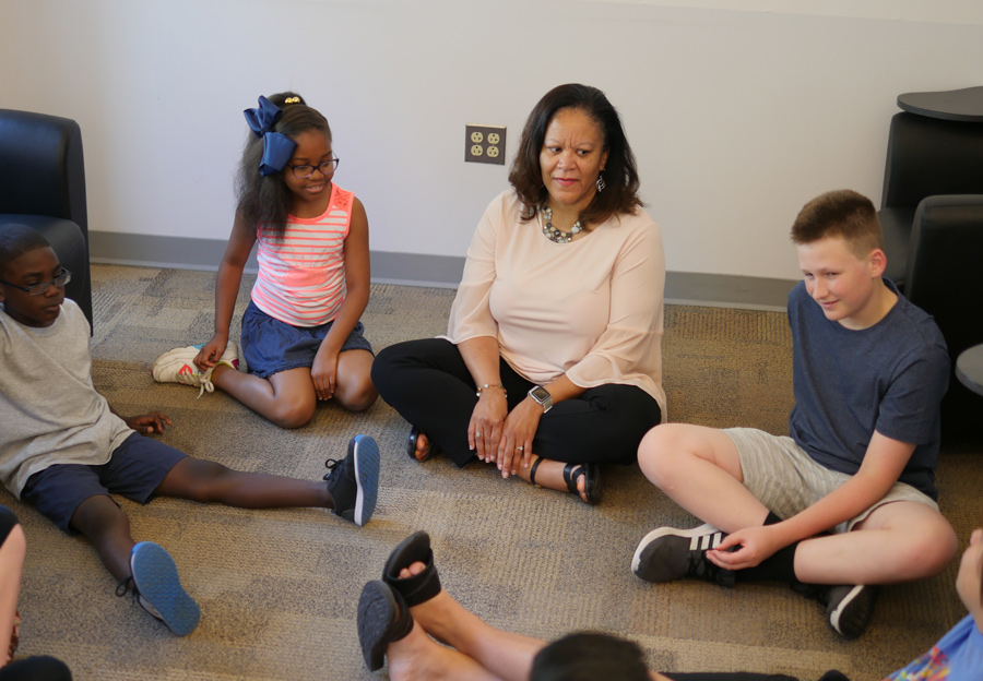 Marsha Richardson, clinical psychologist, senior lecturer, and director of Penn GSE’s School and Mental Health Counseling Program, working with children in a group